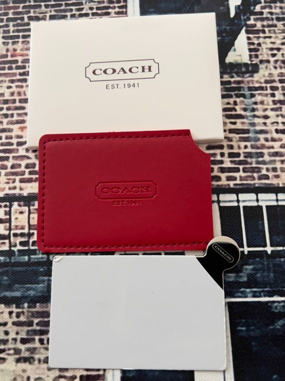 Small Coach promo mirror. Never used paper on mirror is on and box.